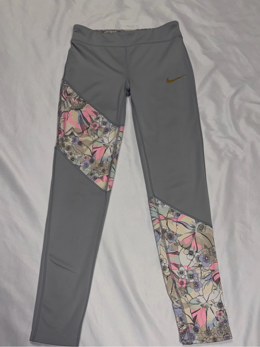 Nike Gray Leggings with Pink Floral Panels and Gold Swoosh Accent